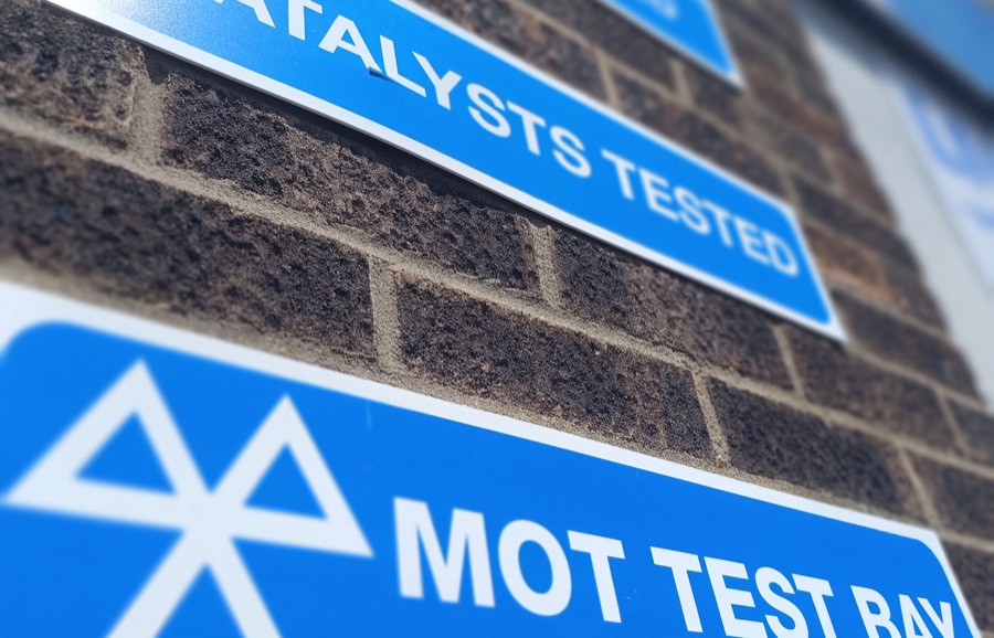 MOT test bay signage at LNC Motors